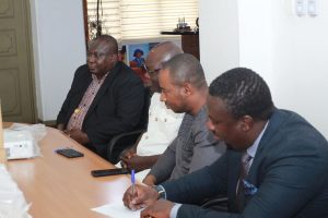 Vice-Chancellor, Prof. Gabriel Dwomoh (3rd from right), and Managing Director of Priority Insurance Company Limited, Mr. Matthew K.A. Aidoo (5th from left), in a group photo with representatives from KsTU and Priority Insurance following the donation of eight projectors to the University.